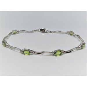 Natural oval faceted peridot sterling silver link bracelet